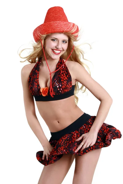 Fröhliches junges Mädchen mit rotem Stetsonhut — Stockfoto