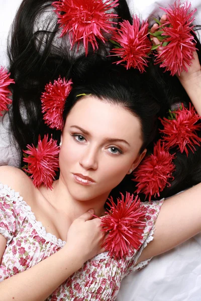 Gorgeous brunette with red aster — Stock Photo, Image