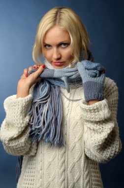 Blonde girl in winter clothes clipart