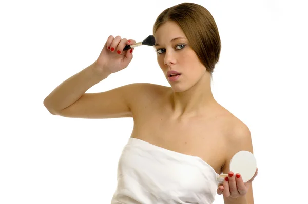 Girl in towel is making up — Stock Photo, Image