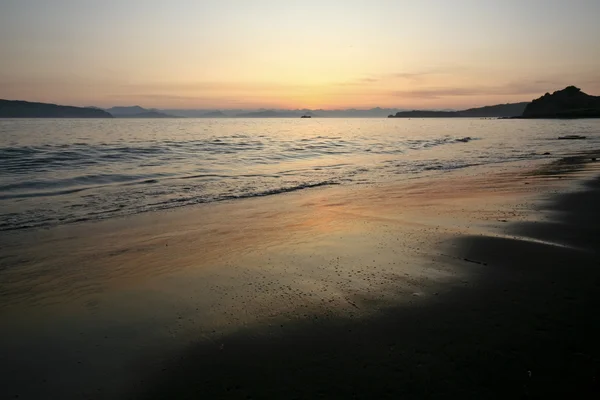 Západ slunce na pláži Stock Snímky
