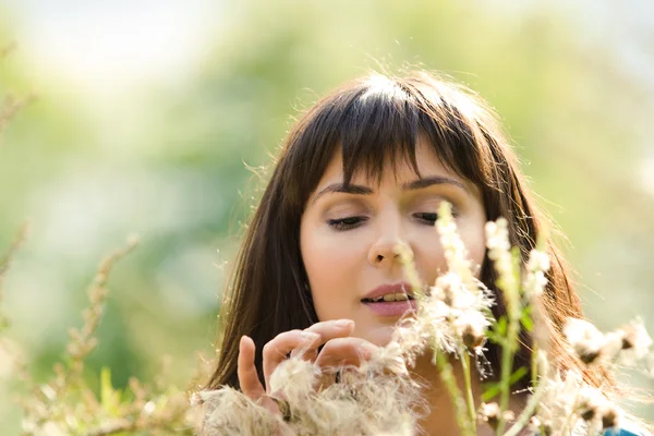 Young beautiful girl on a meadow — Stock Photo, Image