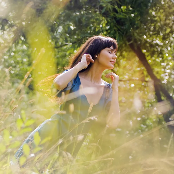 Young beautiful girl on a meadow — Stock Photo, Image