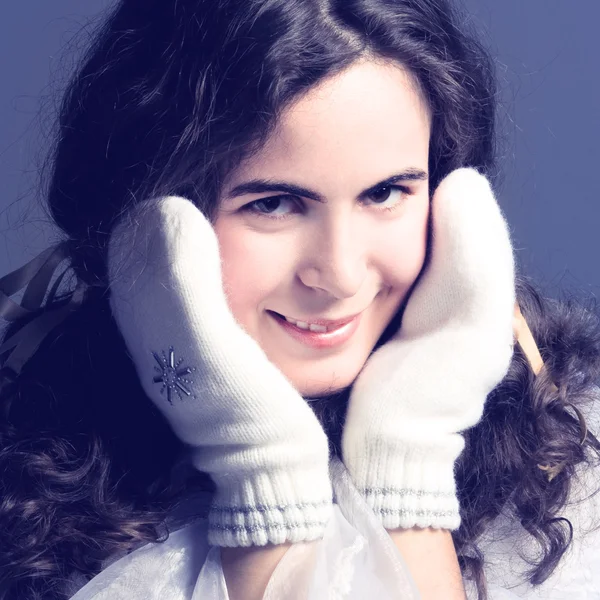 Beautiful girl in white mittens. — Stock Photo, Image