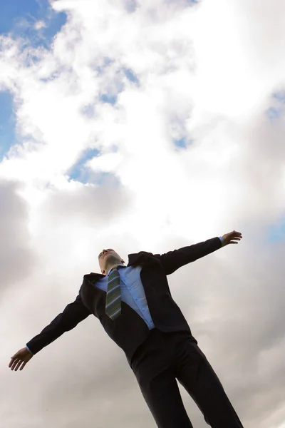Young man in a suit against the sky — Stock Photo, Image