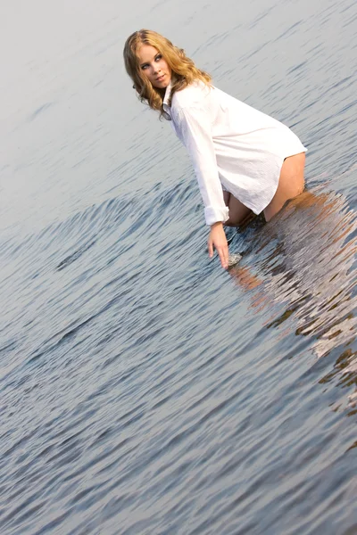 Young beautiful girl in a wet shirt — Stock Photo, Image