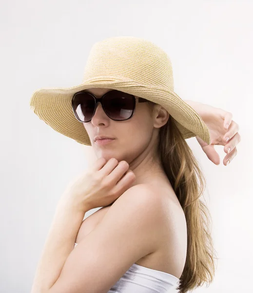 Young beautiful girl in a hat — Stock Photo, Image