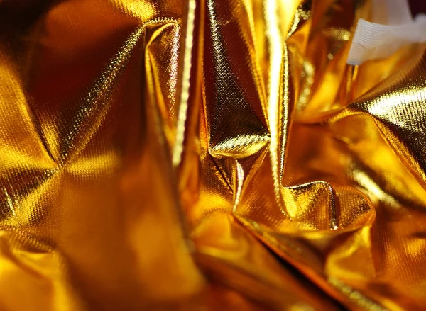 Tło z tkaniną złoty błyszczący — Zdjęcie stockowe