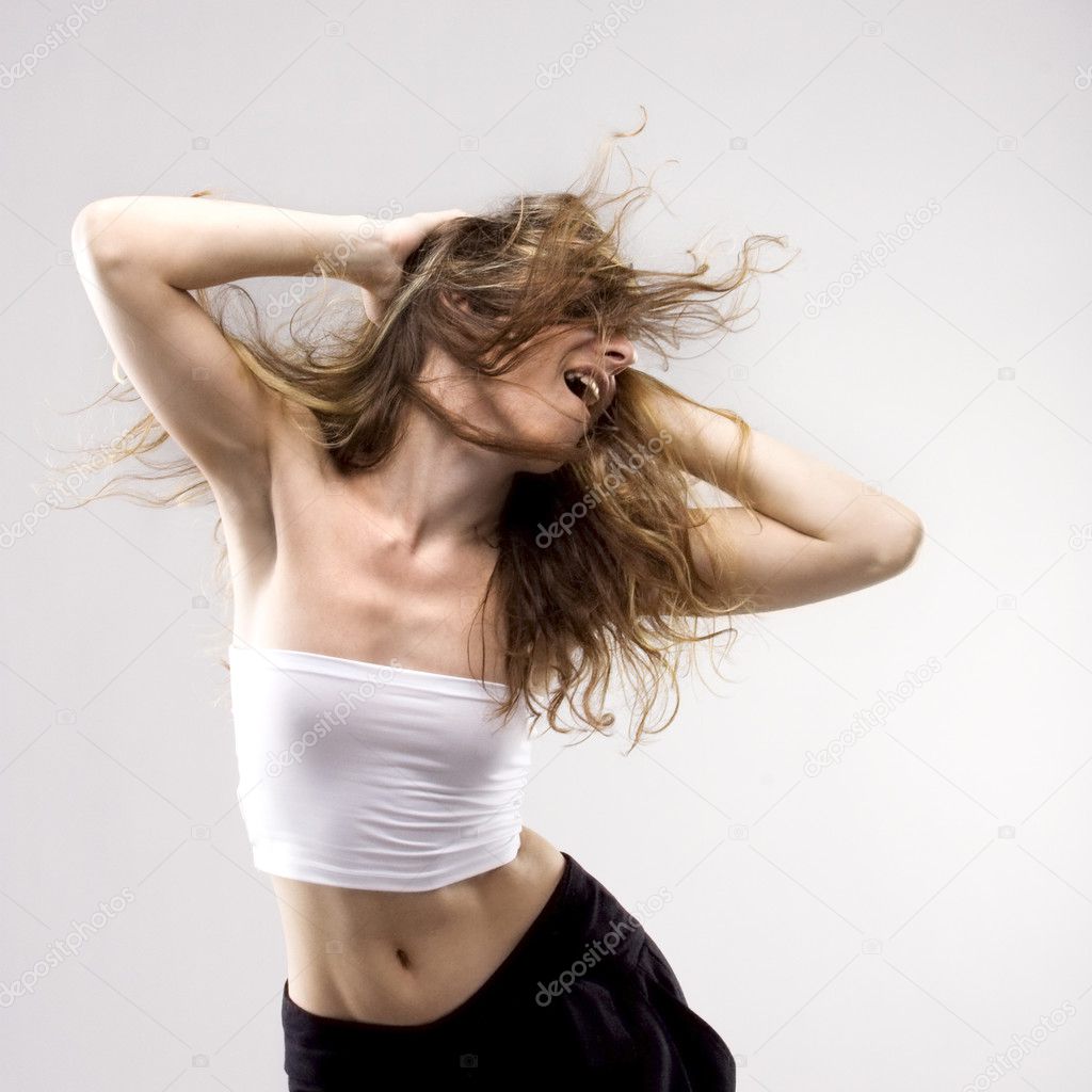 Dancing young girl waves the hairs