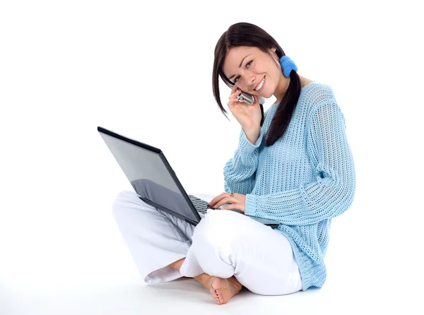 Girl with cellphone and laptop — Stock Photo, Image