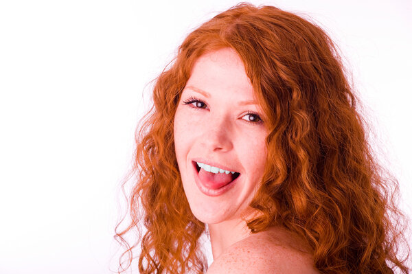 Redheaded girl showing her tongue
