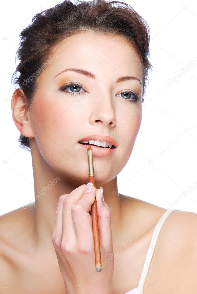 Woman using lip concealer brush — Stock Photo © valuavitaly 1503755