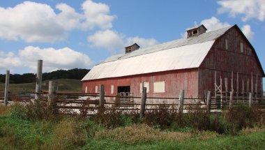 Red barn with two copulas clipart