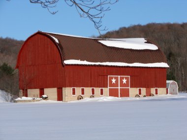 Large red barn with stars on door clipart