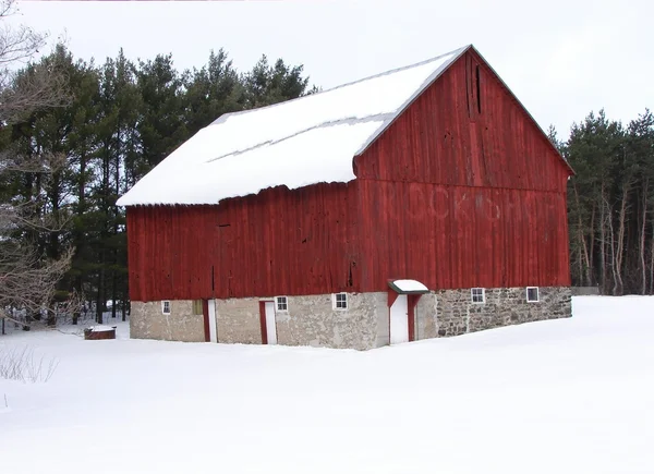 Red barn with stone foundation