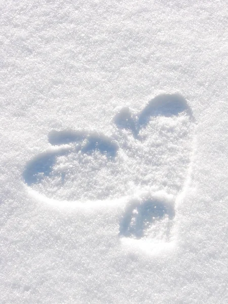 Stock image Imprint of a pair of mittens in snow