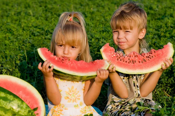 Little girl and boy with watermelon — Stock Photo, Image