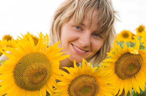 Girl and sunflowers — Stock Photo, Image