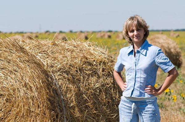 Haystack and girl — Stock Photo, Image