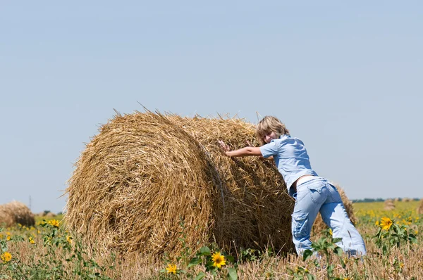 Haystack and girl — Stock Photo, Image