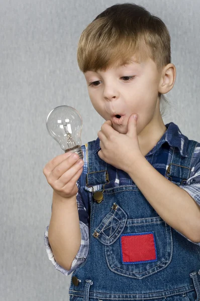 Boy and light bulb — Stock Photo, Image
