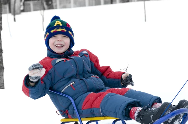 Boy on sledge — Stock Photo, Image