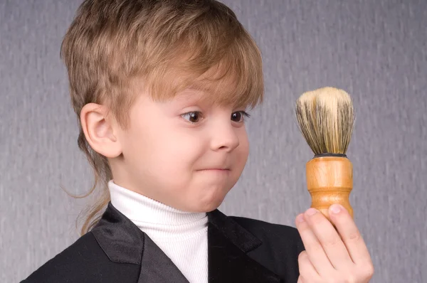 Boy and shaving brush — Stock Photo, Image