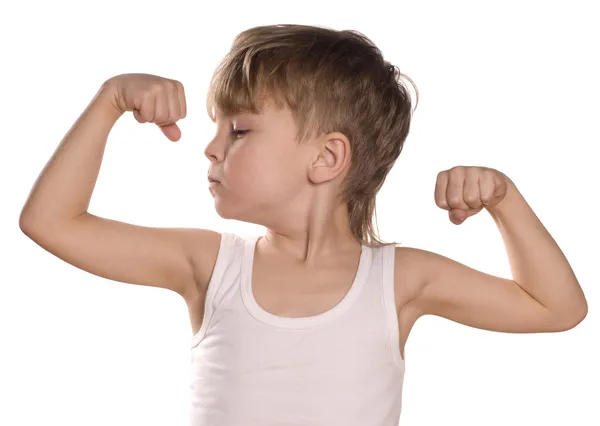 Niño pequeño flexionando bíceps —  Fotos de Stock