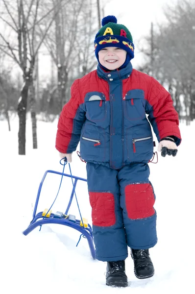 Boy with sledge — Stock Photo, Image