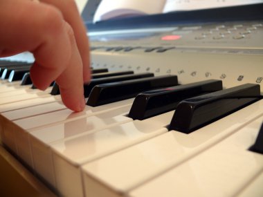 Hand with piano keyboard clipart