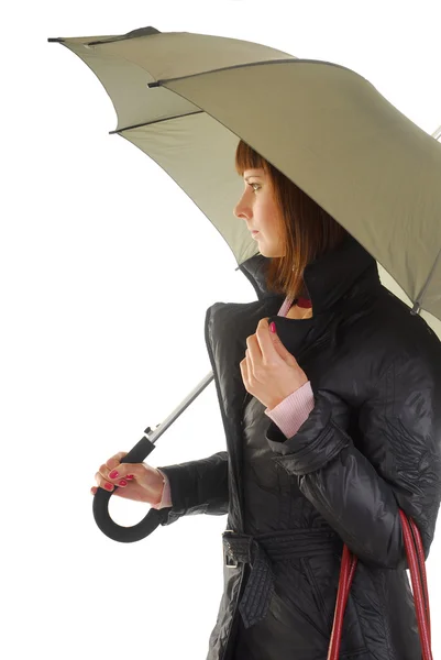 stock image Woman in coat under umbrella