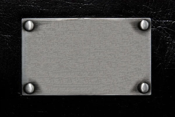 Stainless plate with rivet — Stock Photo, Image