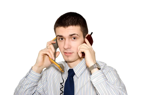 El joven habla por teléfono. Fotos De Stock Sin Royalties Gratis