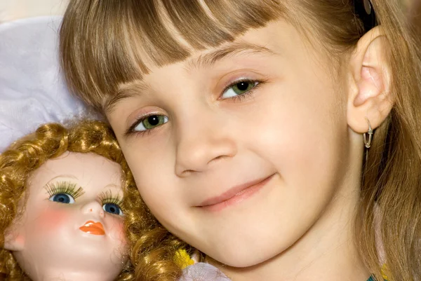The girl with a doll — Stock Photo, Image