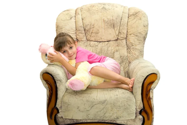 The girl lays in an armchair — Stock Photo, Image