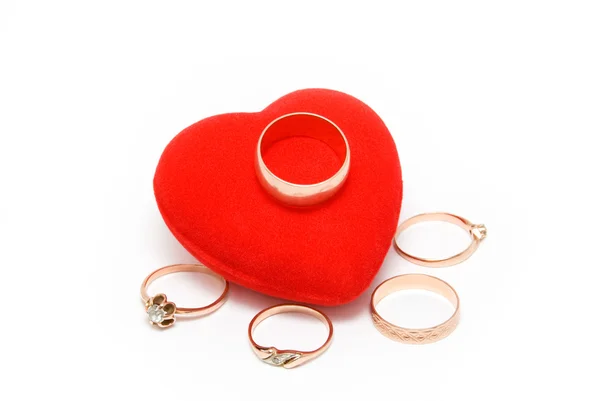 Heart with gold rings — Stock Photo, Image