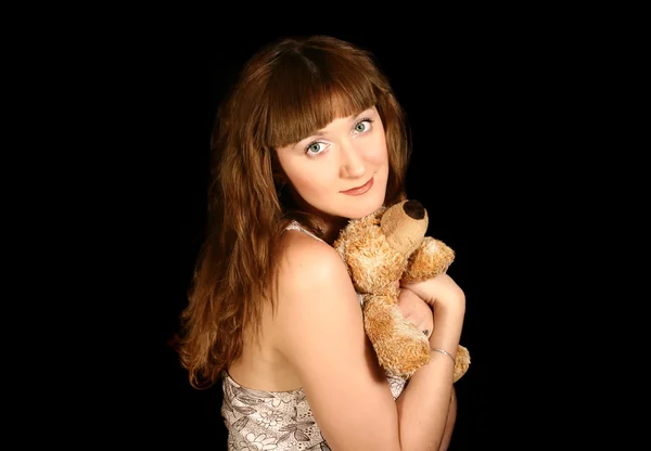 Красивая милая девушка с медведем — стоковое фото