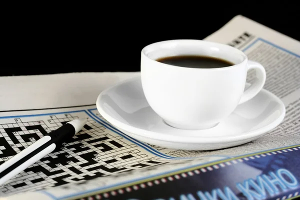 stock image Cup of coffee on the newspaper