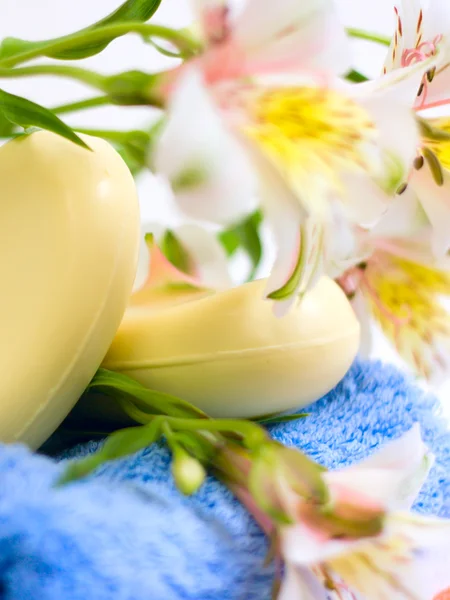 stock image Soap and flower on blue fabric