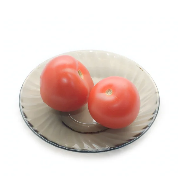 Dos tomates en plato oscuro —  Fotos de Stock