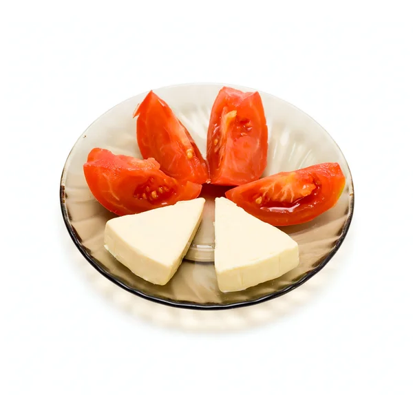 Talíř s rajčaty a sýrem — Stock fotografie