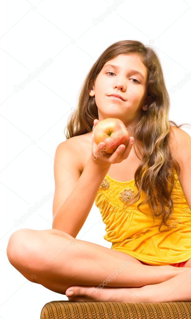 Teen girl eat apple isolated on white