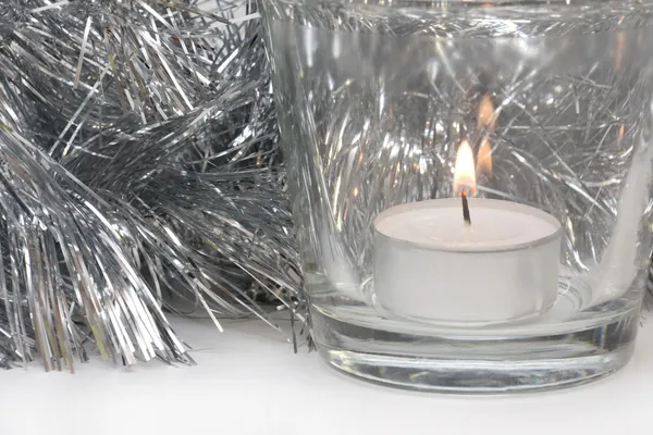 Silvery Tinsel and Candle — Stock Photo, Image