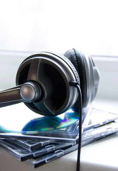 Headphones on the Pile of Disks — Stock Photo, Image