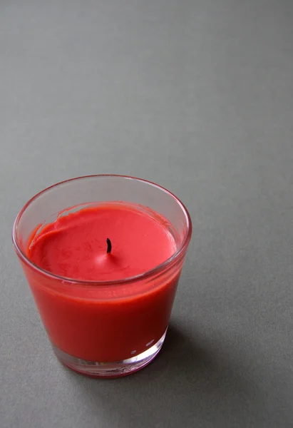 Red Candle against the Green Background — Stock Photo, Image