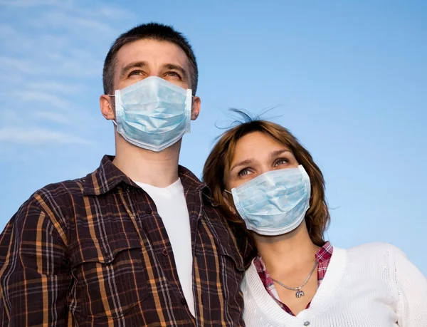 stock image Couple wearing flu masks