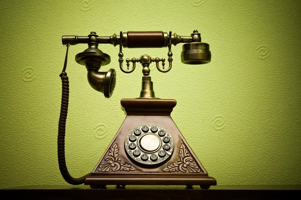 stock image The old phone with disc dials on the background wallpaper