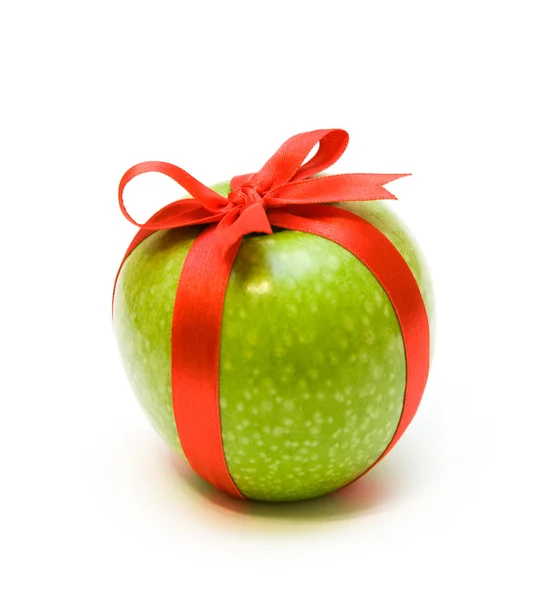 Apple in red tape — Stock Photo, Image