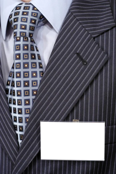 stock image Official suit with blank badge on it.