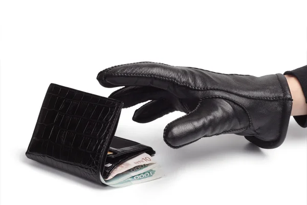 Portefeuille et main d'un voleur . Photo De Stock